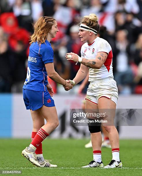 Pauline Bourdon Sansus of France shakes hands with Megan Jones of England after the Women's Rugby World Cup 2025 Semi Final match between France and...