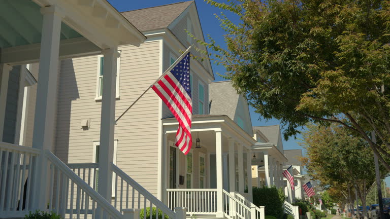 https://media.gettyimages.com/id/2236482779/video/american-flag-new-north-carolina-coastal-homes-steady-shot.jpg?b=1&s=640x640&k=20&c=BOi1QxM-gDbsrPX-uJ628pB2QQRUWlTchxTG5cWzmjk=