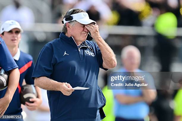 Head coach Bill Belichick of the North Carolina Tar Heels reacts in the first half of a game against the UCF Knights at FBC Mortgage Stadium on...