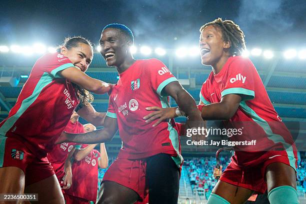 Temwa Chawinga of Kansas City Current celebrates with teammates after winning the Shield following the NWSL match between Kansas City Current and...