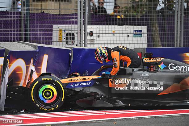 Oscar Piastri of Australia and McLaren climbs out of his damaged car after a crash during the F1 Grand Prix of Azerbaijan at Baku City Circuit on...
