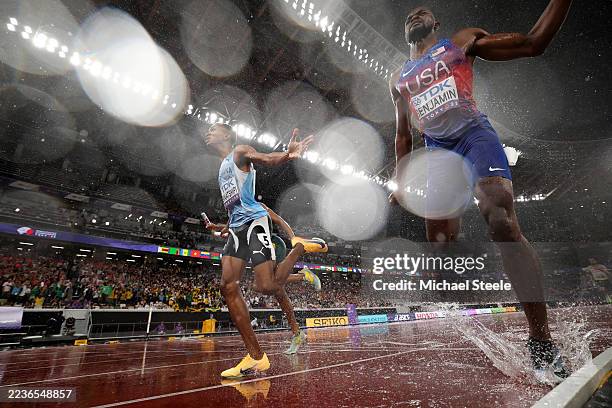Busang Collen Kebinatshipi of Team Botswana crosses the finish line to win the gold medal followed by silver medalist Rai Benjamin of Team United...