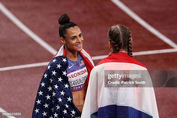 Gold medalist Sydney McLaughlin-Levrone of Team United States and bronze medalist Femke Bol of Team Netherlands embrace after competing in the...