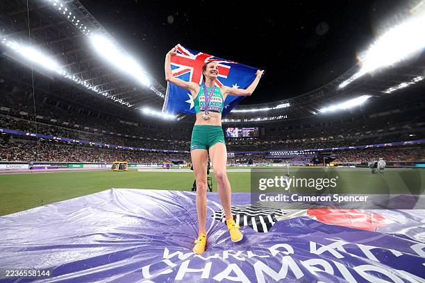 Gold medalist, Nicola Olyslagers of Team Australia, celebrates with the national flag following victory in the Women's High Jump Final on day nine of...