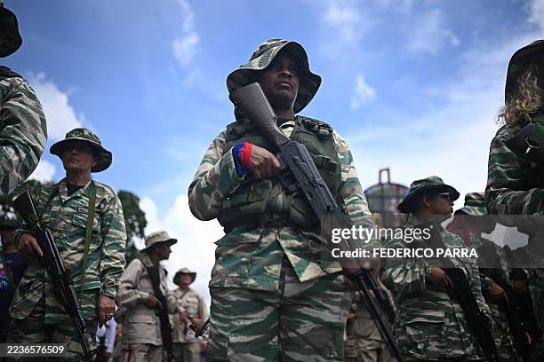 Members of the Bolivarian militia participate in a military deployment in support of Venezuela's President Nicolas Maduro at Bolivar Avenue in...