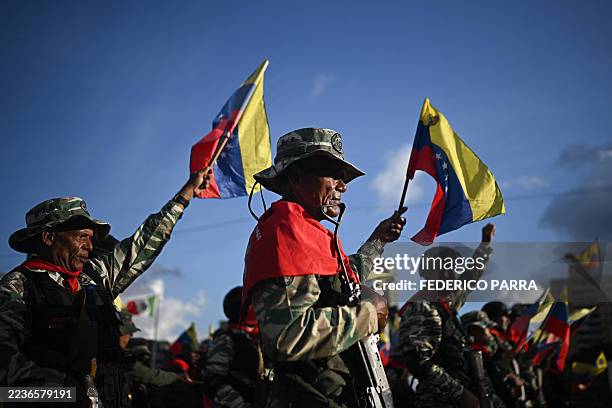 Members of the Bolivarian militia participate in a military deployment in support of Venezuela's President Nicolas Maduro at Bolivar Avenue in...