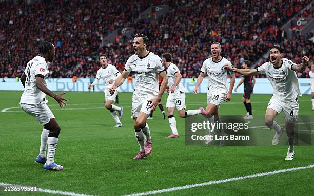Haris Tabakovic of Borussia Monchengladbach celebrates scoring his team's first goal with teammates during the Bundesliga match between Bayer 04...