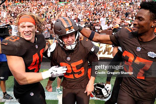 Andre Szmyt of the Cleveland Browns celebrates with teammates after kicking the game winning field goal against the Green Bay Packers during the...