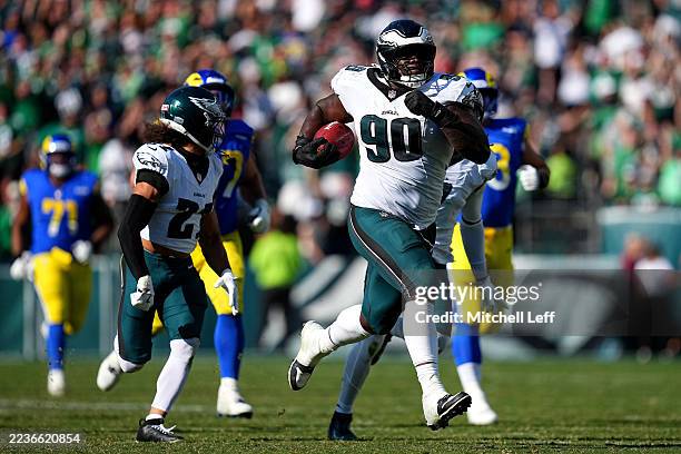 Jordan Davis of the Philadelphia Eagles returns a blocked field goal for a touchdown against the Los Angeles Rams during the fourth quarter at...