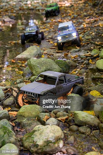 rc car racing on challenging terrain - dried riverbed of a creek - remote control car stock pictures, royalty-free photos & images