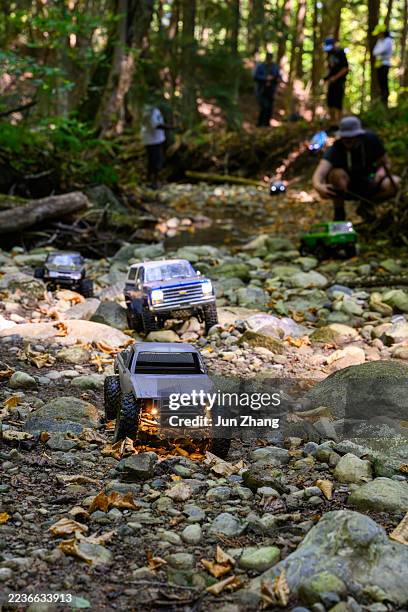 rc car racing on challenging terrain - dried riverbed of a creek - remote control car stock pictures, royalty-free photos & images