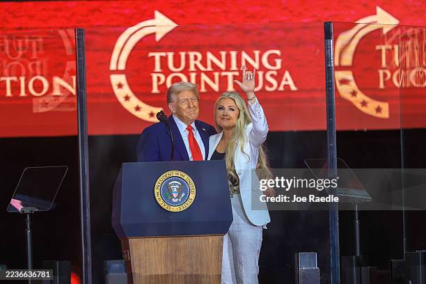 Mrs. Erika Kirk joins U.S. President Donald Trump onstage during the memorial service for political activist Charlie Kirk at State Farm Stadium on...