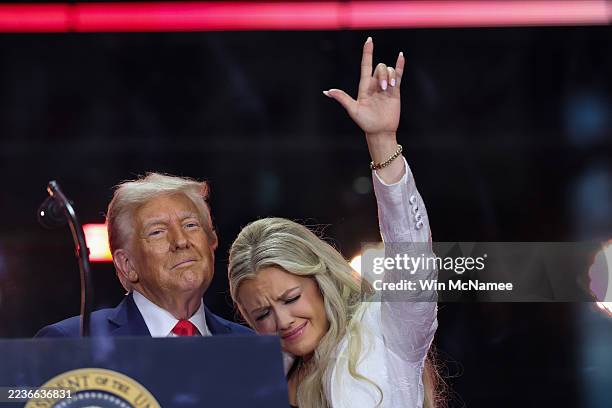 Erika Kirk joins U.S. President Donald Trump onstage during the memorial service for political activist Charlie Kirk at State Farm Stadium on...