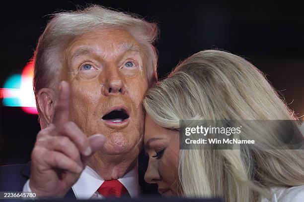 Erika Kirk joins U.S. President Donald Trump onstage during the memorial service for political activist Charlie Kirk at State Farm Stadium on...