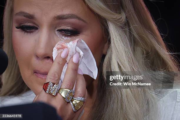 Erika Kirk wipes away tears during the memorial service for her husband, political activist Charlie Kirk at State Farm Stadium on September 21, 2025...