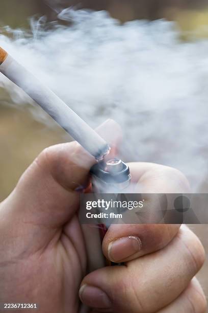 light a cigarette and smoke it all away up light 164 Cropped Image Of Igniting