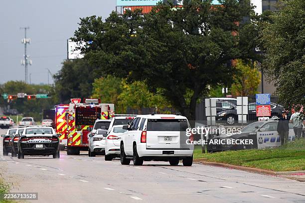 Law enforcement and emergency personnel respond near the scene of a shooting at a US Immigration and Customs Enforcement detention facility in...