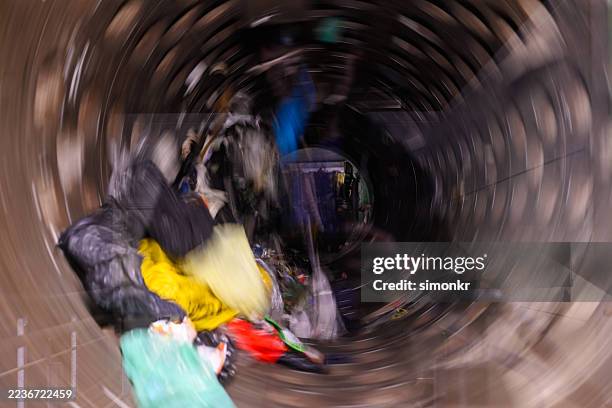 industrial trommel separator processing mixed waste materials - circulaire economie stockfoto's en -beelden