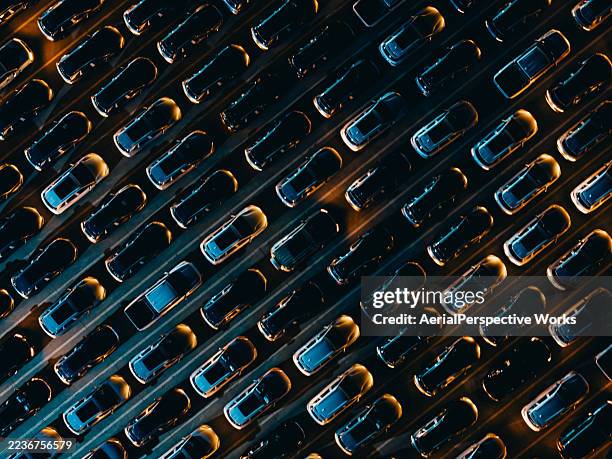 aerial view of cars undergoing various technical tests at night - software quality stock pictures, royalty-free photos & images