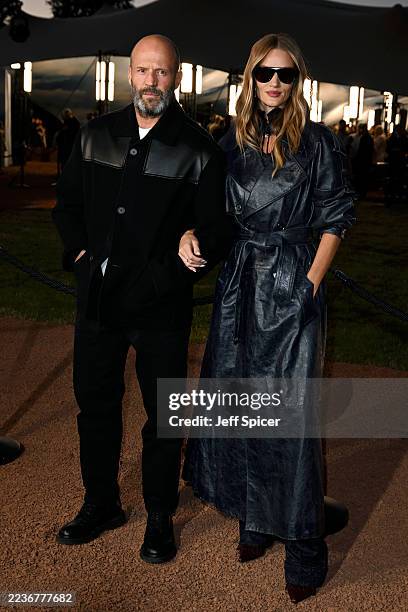 Jason Statham and Rosie Huntington-Whiteley attend the Burberry show during London Fashion Week September 2025 at Hyde Park on September 22, 2025 in...