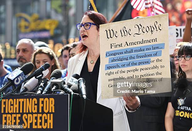 Rep. Laura Friedman displays a section of the First Amendment during a protest against the suspension of the "Jimmy Kimmel Live!" show, held across...