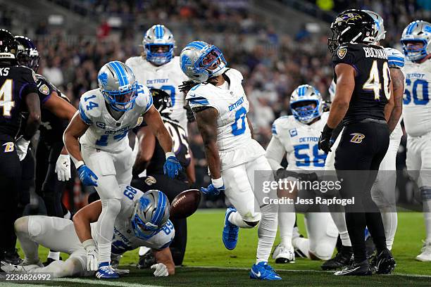 Jahmyr Gibbs of the Detroit Lions celebrates scoring a touchdown against the Baltimore Ravens during the first quarter at M&T Bank Stadium on...