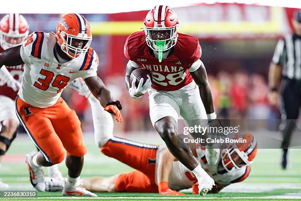 Khobie Martin of the Indiana Hoosiers runs for a touchdown against the Illinois Fighting Illini in the second half at Memorial Stadium on September...