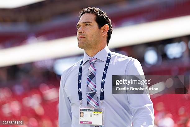 Broadcaster Mark Sanchez stands on the field prior to an NFL football game between the Arizona Cardinals and the San Francisco 49ers at Levi's...