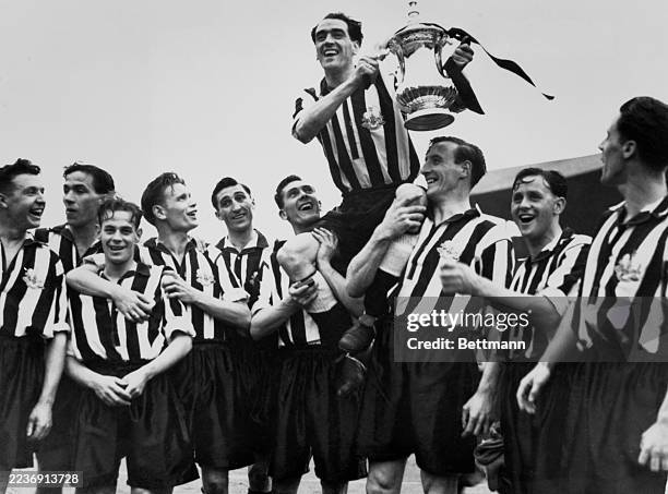 Captain Joe Harvey holding up the trophy after Newcastle United defeated Blackpool in the FA Cup Final at Wembley Arena in London, April 28th 1951....