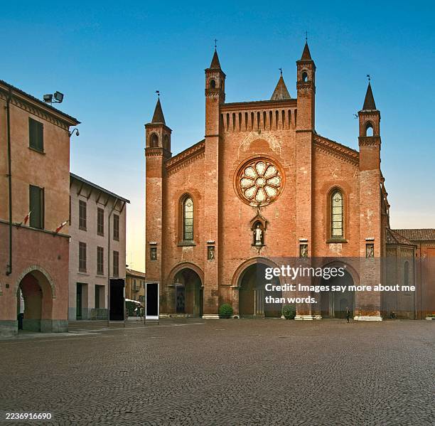 alba's central square at sunset, with the cathedral in the background - piemonte. - piedmont italy stock pictures, royalty-free photos & images