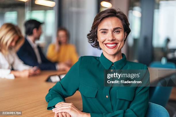confident businesswoman in modern office - well dressed stock pictures, royalty-free photos & images