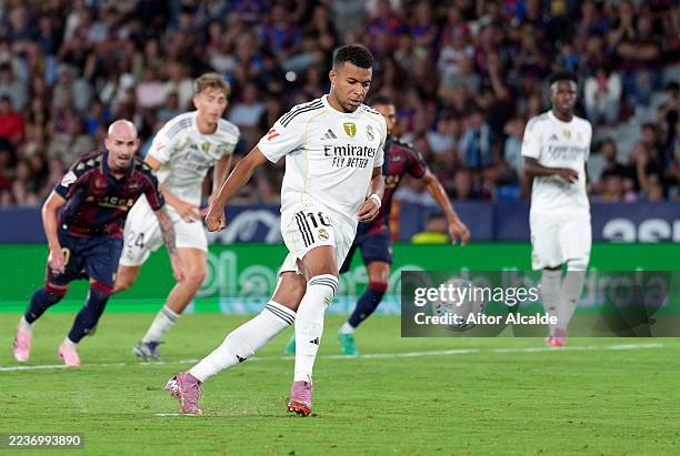 Kylian Mbappe of Real Madrid scores his team's third goal from the penalty spot during the LaLiga EA Sports match between Levante UD and Real Madrid...