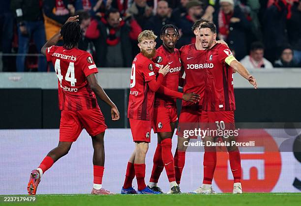 Patrick Osterhage of SC Freiburg celebrates scoring his team's first goal with teammates during the UEFA Europa League 2025/26 League Phase MD1 match...