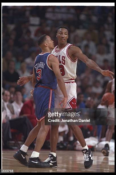 Forward Scottie Pippen of the Chicago Bulls works against guard John Starks of the New York Knicks during the Eastern Conference final at the United...