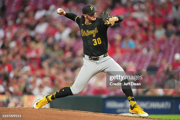 Paul Skenes of the Pittsburgh Pirates throws during the third inning of a baseball game against the Cincinnati Reds at Great American Ball Park on...