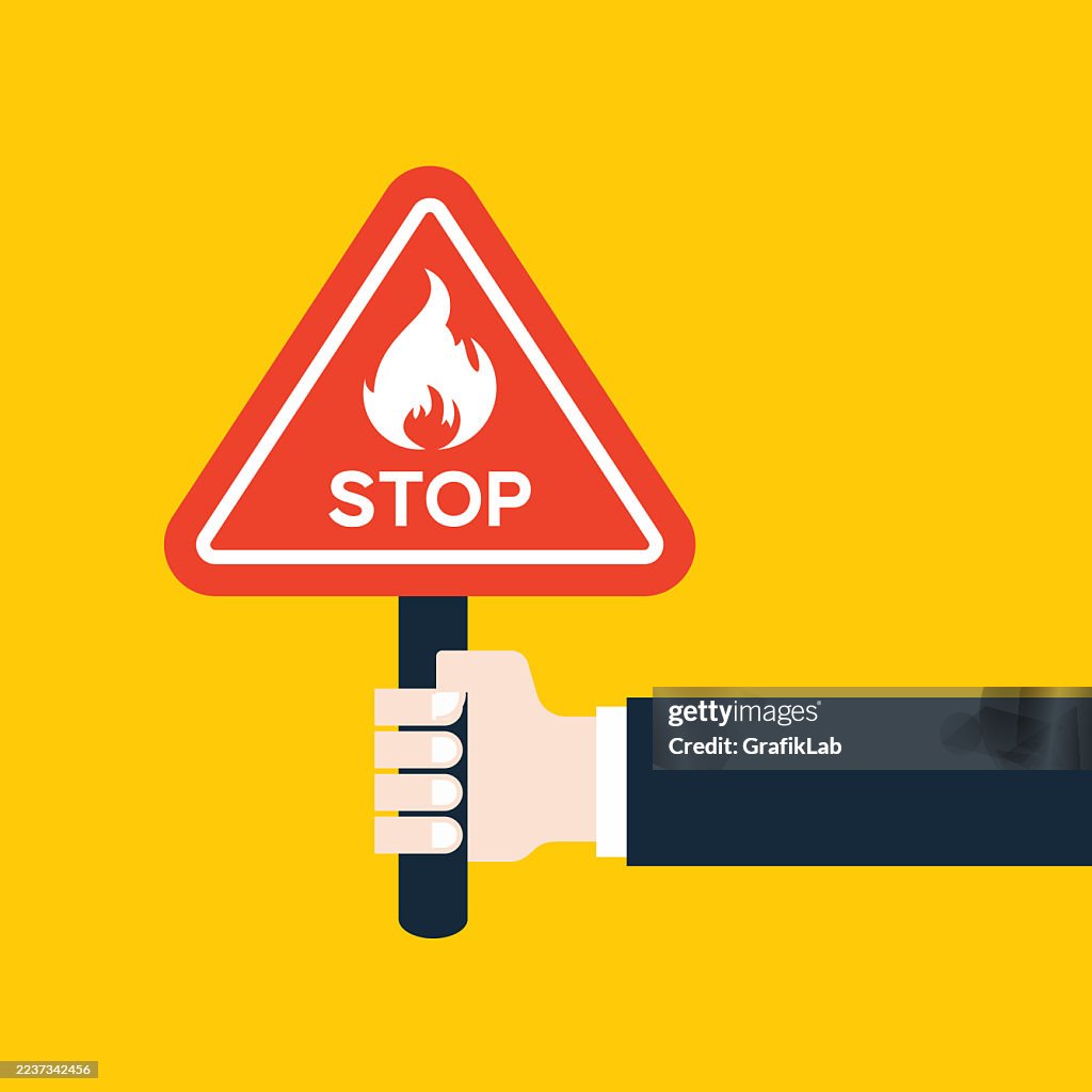 Vector Hand Holding Fire Warning Stop Sign on Yellow Background
