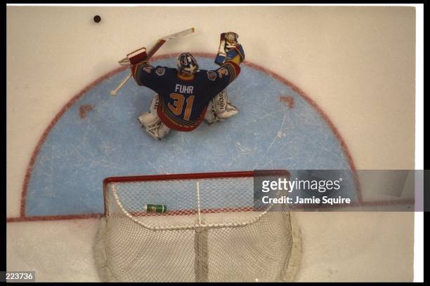 Goaltender Grant Fuhr of the St. Louis Blues looks on during a game against the Anaheim Mighty Ducks at Arrowhead Pond in Anaheim, California. The...