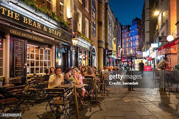london leicester square pub night uk - pub scene stock pictures, royalty-free photos & images