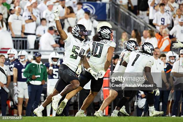 Jerry Mixon of the Oregon Ducks celebrates after an interception during second overtime against the Penn State Nittany Lions at Beaver Stadium on...