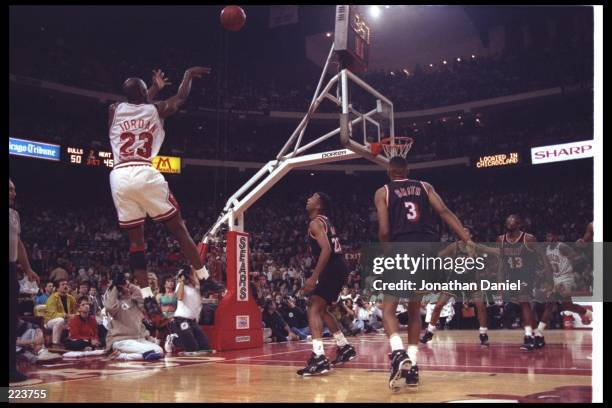 Guard Michael Jordan of the Chicago Bulls takes a shot during a first round playoff game against the Miami Heat at the United Center in Chicago,...