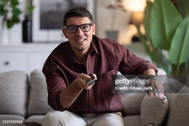 changing channels - tv controller stock pictures, royalty-free photos & images
