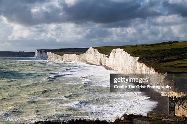 storm clouds and rain moving over the seven sisters cliffs - english channel stock pictures, royalty-free photos & images