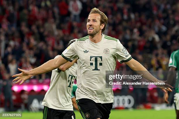Harry Kane of Bayern Munich celebrates after scoring his team's third goal to reach a record club 100 goals during the Bundesliga match between FC...