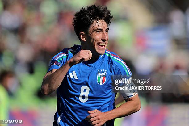 Italy's midfielder Mattia Mannini celebrates after scoring a penalty during the 2025 FIFA U20 World Cup football match between Italy and Australia at...