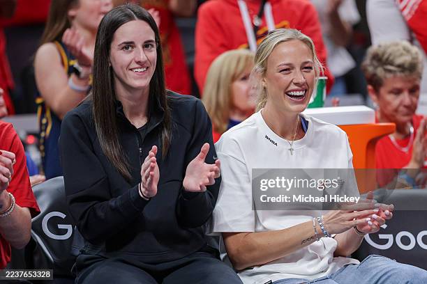Caitlin Clark and Sophie Cunningham of the Indiana Fever react during the second half against the Las Vegas Aces in Game Four of the semifinals of...
