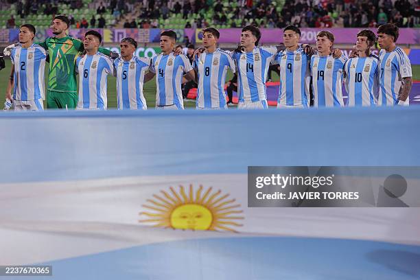 The Argentine players sing the national anthem before the 2025 FIFA U20 World Cup football match between Cuba and Argentina at the Elias Figueroa...