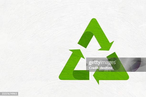 green colored arrows making a recycle symbol or recycling icon three dimensional design over scratched textured wall like adobe material white vector background with copy space, for environment sustainability posters banners - wall angle stock illustrations