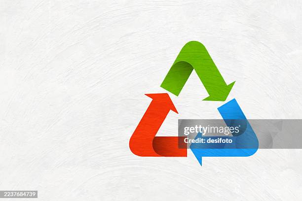 colorful arrows making a recycle symbol or recycling icon three dimensional design in red, blue and green colors over scratched textured wall like adobe material white vector background with copy space, for environment sustainability posters banners - poster plaster wall stock illustrations