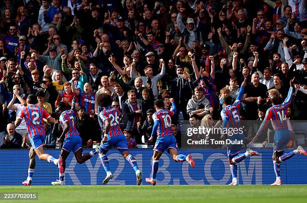 Ismaila Sarr of Crystal Palace celebrates scoring his team's first goal with teammates during the Premier League match between Crystal Palace and...