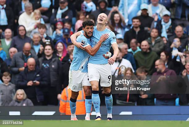 Erling Haaland of Manchester City celebrates scoring his team's fourth goal with teammate Matheus Nunes of Manchester City during the Premier League...